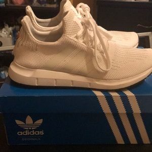 All white adidas swift run shoes